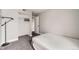 This bedroom features neutral colors, carpet flooring, a closet, and access to the bathroom at 15350 E Arizona Ave # 308, Aurora, CO 80017