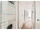 Hallway with laundry appliances and storage, offers convenience and practicality at 15350 E Arizona Ave # 308, Aurora, CO 80017