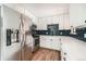 Well-appointed kitchen with new stainless appliances and granite countertops at 15350 E Arizona Ave # 308, Aurora, CO 80017