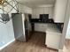 Modern kitchen with stainless steel appliances and white cabinets at 15350 E Arizona Ave # 308, Aurora, CO 80017
