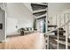 Open living area with wood floors and spiral staircase to the upper floor at 15350 E Arizona Ave # 308, Aurora, CO 80017