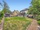 Large backyard featuring a well-manicured lawn, gazebo, and a partial view of the home's rear exterior at 12610 E Villanova Dr, Aurora, CO 80014