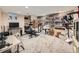Basement with a variety of exercise equipment and shelving units, perfect for workouts and storage at 12610 E Villanova Dr, Aurora, CO 80014