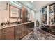 Lavish bathroom showcasing dual vanities, black marble, and a luxurious spa shower at 12610 E Villanova Dr, Aurora, CO 80014