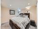 Cozy bedroom featuring a large bed, soft lighting, and a relaxing ambiance at 12610 E Villanova Dr, Aurora, CO 80014
