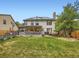 Spacious backyard showcasing the home's exterior, solar panels, and outdoor living space at 12610 E Villanova Dr, Aurora, CO 80014