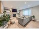 Spacious living room with a fireplace, built-in shelving, and large windows providing ample natural light at 12610 E Villanova Dr, Aurora, CO 80014
