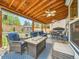 Inviting outdoor patio with comfortable seating, ceiling fans, and a cozy outdoor gathering area at 12610 E Villanova Dr, Aurora, CO 80014