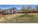 Expansive backyard featuring a lush lawn, privacy fence, and mature trees, perfect for outdoor activities at 12771 Clermont St, Thornton, CO 80241
