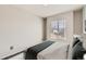 Simple bedroom with window blinds allowing natural light and neutral walls at 12771 Clermont St, Thornton, CO 80241