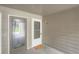 Condo entryway featuring unit number, welcome mat, and a secure, well-lit entrance at 2575 S Syracuse Way # B107, Denver, CO 80231
