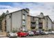 Condo building features balconies, stone accents, and ample parking at 2575 S Syracuse Way # B107, Denver, CO 80231
