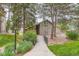 Charming condo exterior with a stone facade, and a quaint walkway entrance at 2575 S Syracuse Way # B107, Denver, CO 80231