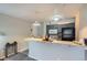 Stylish kitchen with a breakfast bar, granite counters, and modern pendant lighting at 2575 S Syracuse Way # B107, Denver, CO 80231