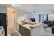 Bright kitchen with granite countertops, stainless steel sink, and updated appliances at 2575 S Syracuse Way # B107, Denver, CO 80231
