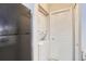 In-unit laundry area featuring stackable washer and dryer and storage space at 2575 S Syracuse Way # B107, Denver, CO 80231