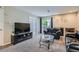 Comfortable living room with fireplace, plush carpet, and access to outdoor space at 2575 S Syracuse Way # B107, Denver, CO 80231