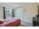 Bright bedroom with sliding door to the outside and a double closet at 2575 S Syracuse Way # B107, Denver, CO 80231