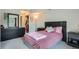 Bedroom features a full closet and dark dresser at 2575 S Syracuse Way # B107, Denver, CO 80231