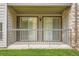 Exterior view of a back porch with railing and double doors at 2575 S Syracuse Way # B107, Denver, CO 80231