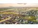 Wide aerial view of a neighborhood and nearby green spaces showcasing walking trails and city views at 13753 Jasmine St, Thornton, CO 80602
