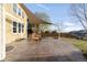 Spacious backyard featuring an expansive stamped concrete patio with a shade sail, perfect for outdoor entertaining at 13753 Jasmine St, Thornton, CO 80602