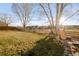 Lush backyard featuring mature trees, a play structure, and plenty of open green space, perfect for outdoor activities at 13753 Jasmine St, Thornton, CO 80602