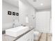 Well-lit bathroom featuring a rectangular vessel sink, granite countertops, and a shower-tub combination at 13753 Jasmine St, Thornton, CO 80602
