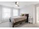 Cozy bedroom with a platform bed, sheer curtains, and lots of natural light, creating a serene atmosphere at 13753 Jasmine St, Thornton, CO 80602