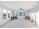 Versatile bonus room features large windows, natural light, and ample space for a variety of uses at 13753 Jasmine St, Thornton, CO 80602