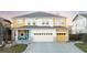 Charming two-story home with yellow siding, stone accents, and a well-maintained front yard at 13753 Jasmine St, Thornton, CO 80602