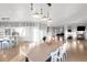 Open-concept kitchen with large dining table and lots of natural light at 13753 Jasmine St, Thornton, CO 80602