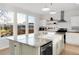 Bright kitchen with a large island, stainless steel appliances, and a stylish design at 13753 Jasmine St, Thornton, CO 80602