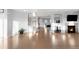 Open living space with hardwood floors and fireplace at 13753 Jasmine St, Thornton, CO 80602