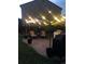 Cozy backyard patio with outdoor seating and ambient lighting, ideal for evening relaxation at 10732 Cook Ct, Northglenn, CO 80233