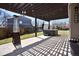 Covered patio featuring a grill, hot tub, heat lamp and string lights at 10732 Cook Ct, Northglenn, CO 80233