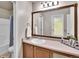 Bathroom featuring one sink, a bathtub-shower combo; complemented by neutral finishes at 10732 Cook Ct, Northglenn, CO 80233