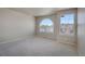 This spacious bedroom has large windows and carpet at 10732 Cook Ct, Northglenn, CO 80233