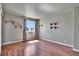 This bright bedroom has wood floors and a window at 10732 Cook Ct, Northglenn, CO 80233