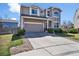 Charming two-story home with a well-manicured lawn, mature landscaping, and a spacious driveway at 10732 Cook Ct, Northglenn, CO 80233