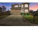 Charming two-story home with a well-manicured lawn, mature landscaping, and a spacious driveway at 10732 Cook Ct, Northglenn, CO 80233