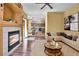 Inviting living area with fireplace, opening to dining space and kitchen, creating an open feel at 10732 Cook Ct, Northglenn, CO 80233