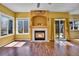 Bright living room with a fireplace and sliding glass doors to the backyard at 10732 Cook Ct, Northglenn, CO 80233