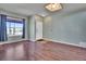 Inviting living room with hardwood floors, neutral paint, and ample natural light at 10732 Cook Ct, Northglenn, CO 80233