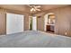 Spacious main bedroom with large closets, neutral carpeting, and an ensuite bathroom at 10732 Cook Ct, Northglenn, CO 80233