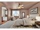 This main bedroom has a ceiling fan, carpet, and ensuite bathroom with tub at 10732 Cook Ct, Northglenn, CO 80233