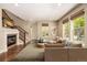 Spacious living room featuring hardwood floors and ample natural light at 8482 Parkland St, Broomfield, CO 80021