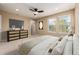 Bright main bedroom with large windows and ceiling fan at 8482 Parkland St, Broomfield, CO 80021