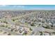An aerial view shows a neighborhood of single-Gathering homes with well-maintained lawns and tree-lined streets at 5149 S Tibet St, Aurora, CO 80015