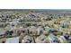Aerial view of a neighborhood with tree-lined streets and well-maintained lawns, showcasing a Gathering-friendly atmosphere at 5149 S Tibet St, Aurora, CO 80015